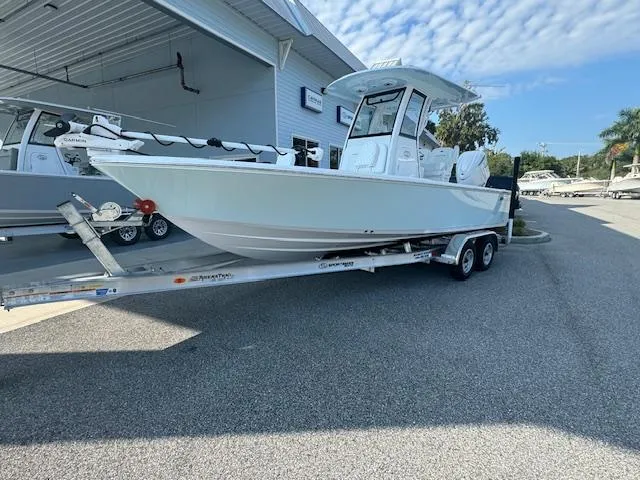 Slide: The Image of 2025 Sportsman Masters 247 Bay Boat on trailer outside dealership. - 0