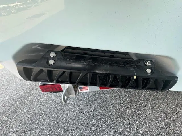 Slide: The Image of Rear view of a 2025 Sportsman Masters 247 Bay Boat with visible hardware. - 14