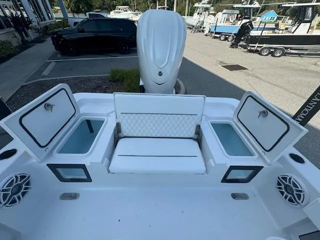 Slide: The Image of 2025 Sportsman Masters 247 Bay Boat with open storage compartments and seating. - 15