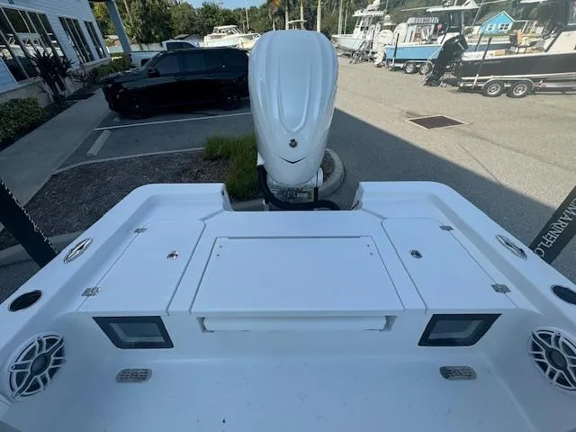 Slide: The Image of 2025 Sportsman Masters 247 Bay Boat, rear view with motor, docked at marina. - 20