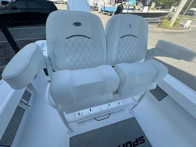 Slide: The Image of 2025 Sportsman Masters 247 Bay Boat with luxurious white seating and armrests. - 26