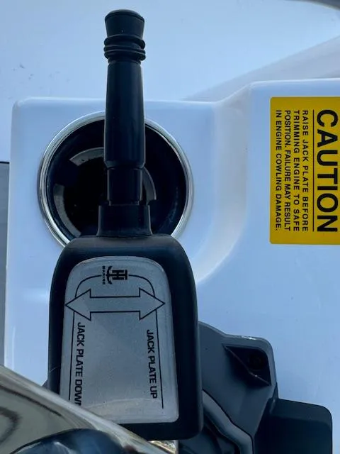 Slide: The Image of Jack plate control on 2025 Sportsman Masters 247 Bay Boat with caution label. - 29