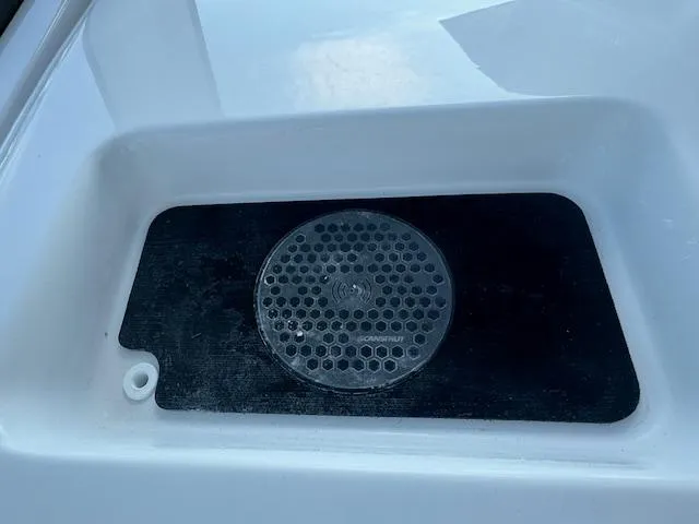 Slide: The Image of 2025 Sportsman Masters 247 Bay Boat speaker detail in white compartment. - 32