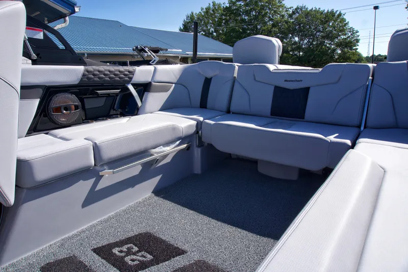 Slide: The Image of Interior of 2025 MasterCraft XT23 boat with luxurious seating and modern design. - 17
