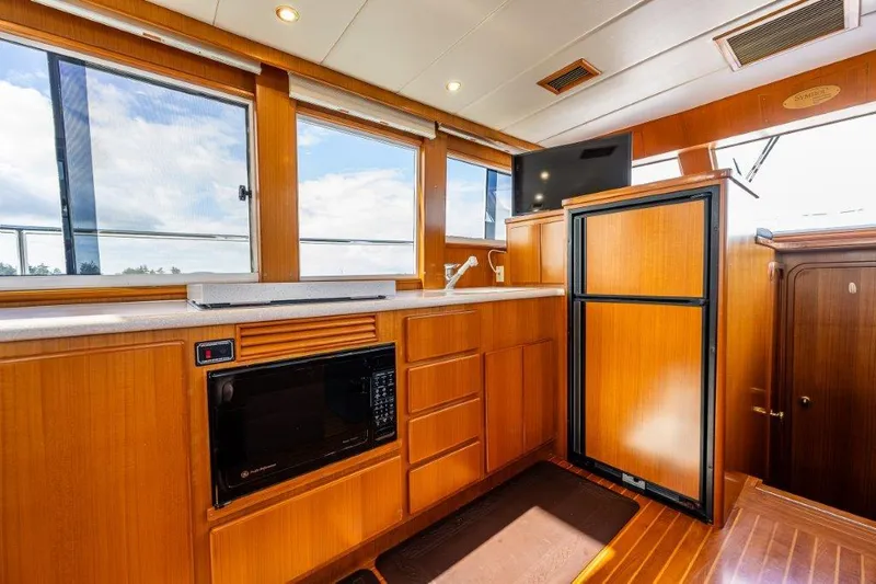 Slide: The Image of Interior of 2000 Symbol 42 Classic Trawler with wood cabinetry and modern appliances. - 12