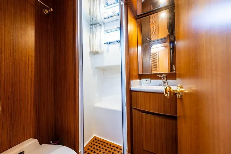 Slide: The Image of Luxurious bathroom interior of 2000 Symbol 42 Classic Trawler yacht with wooden cabinetry. - 26