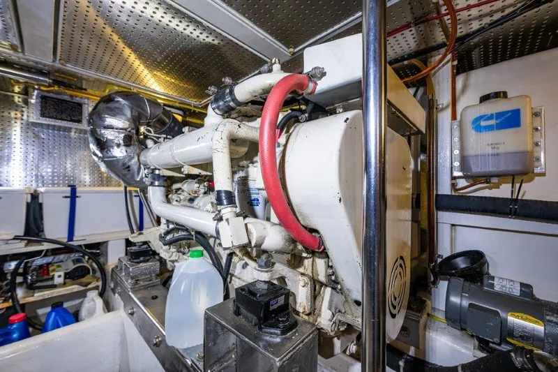 Slide: The Image of Engine room of 2000 Symbol 42 Classic Trawler with visible machinery and equipment. - 38