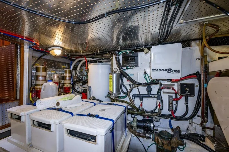 Slide: The Image of Engine room of 2000 Symbol 42 Classic Trawler with equipment and wiring. - 40