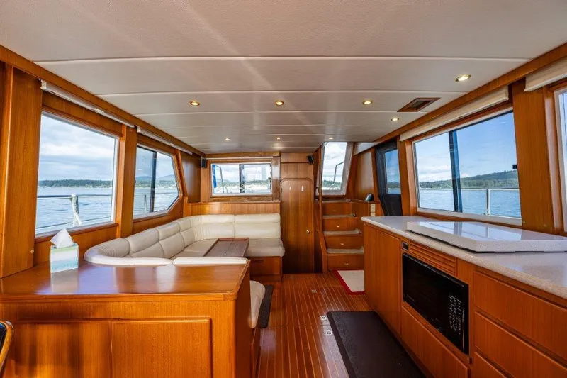Slide: The Image of Interior of 2000 Symbol 42 Classic Trawler with wood finish and panoramic windows. - 8