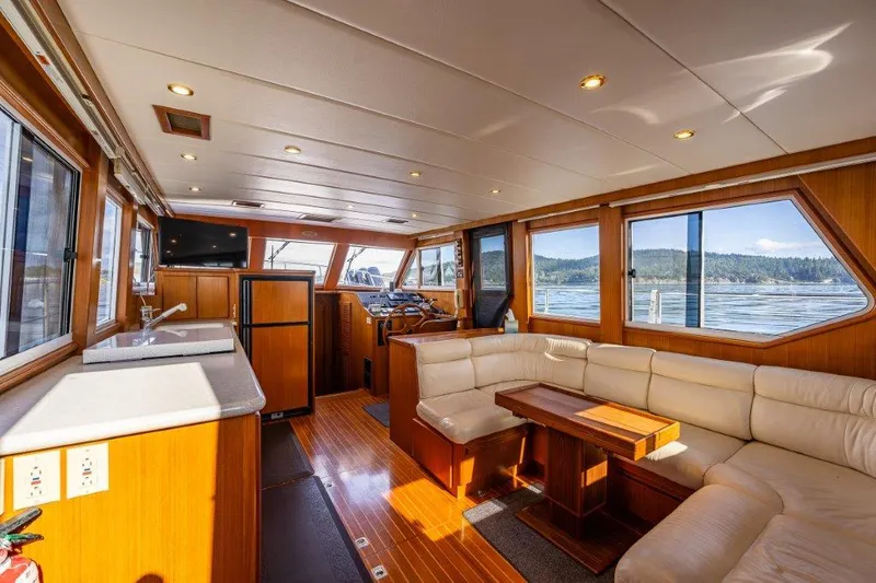 Slide: The Image of Interior of 2000 Symbol 42 Classic Trawler with wood finish and panoramic windows. - 9