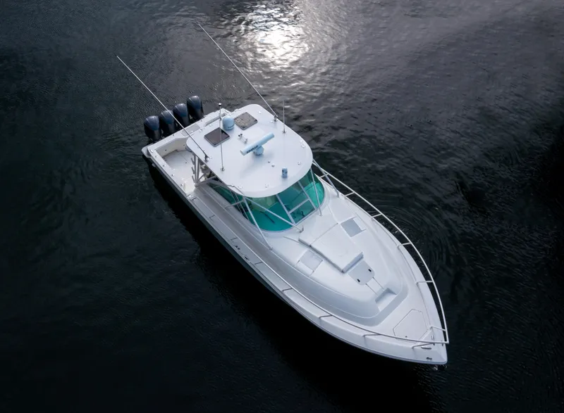 Slide: The Image of 2011 SeaVee 430 Sport Express boat on calm water, aerial view. - 5