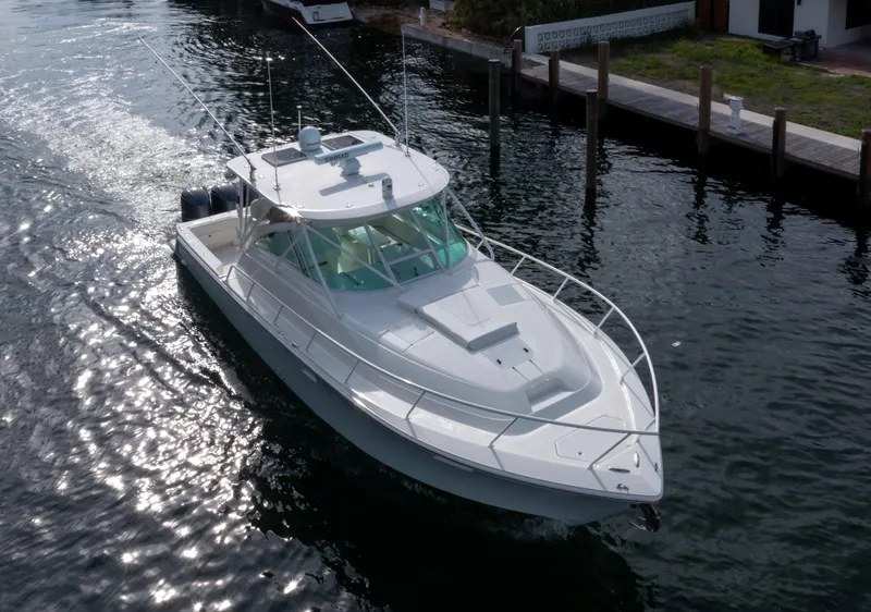 Slide: The Image of 2011 SeaVee 430 Sport Express cruising on a sunlit waterway. - 6
