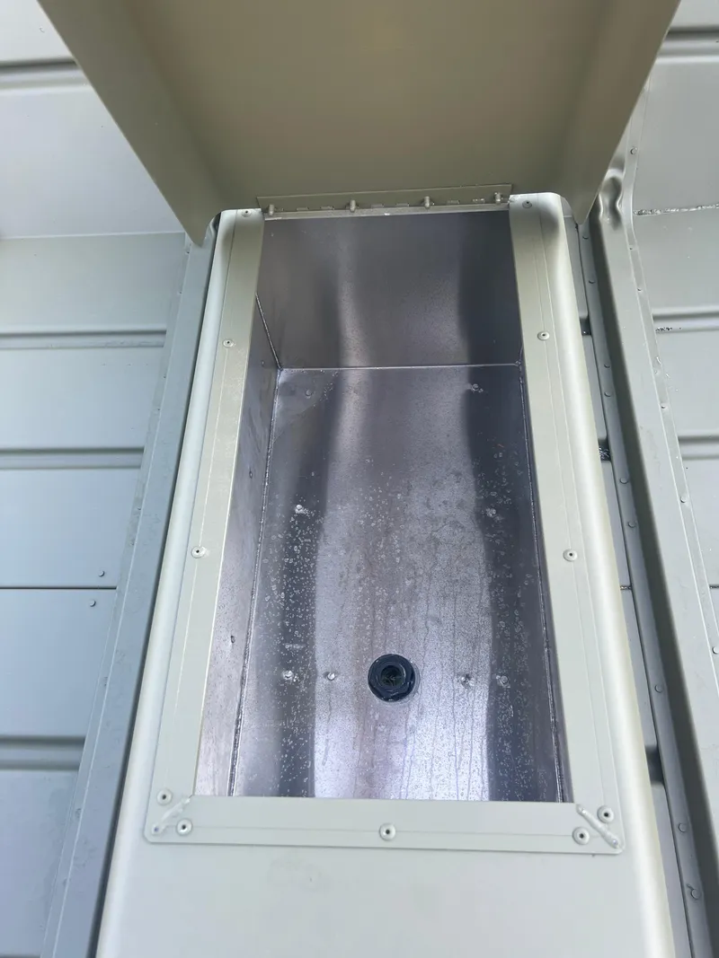 Slide: The Image of Open compartment of 2025 Lund 1448 boat, showcasing interior details. - 6