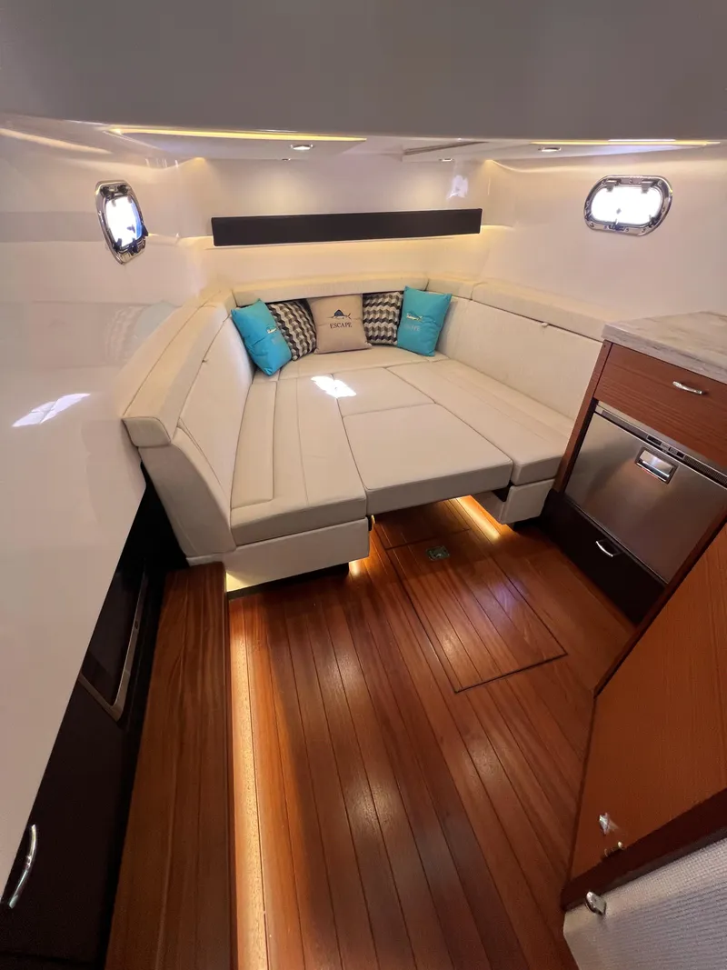 Slide: The Image of Luxurious interior of 2020 Pursuit S408 boat with elegant seating and wood flooring. - 24