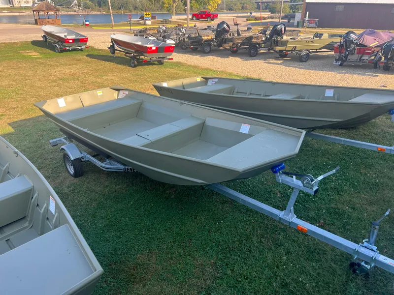 The Image of 2025 Lund 1648M boats on trailers, displayed outdoors on grass. - 0