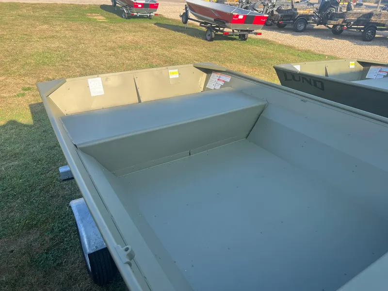 Slide: The Image of 2025 Lund 1648M boat on trailer, displayed outdoors. - 3