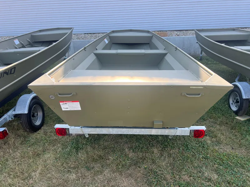 Slide: The Image of 2025 Lund 1648M boat on trailer, displayed outdoors. - 5