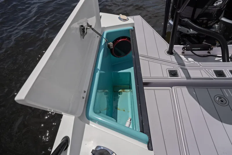 Slide: The Image of Axopar 37XC CROSS CABIN 2023 boat storage compartment open on deck. - 16