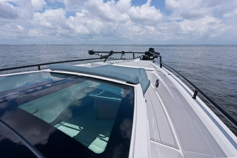 Slide: The Image of Axopar 37XC CROSS CABIN 2023 on open water under cloudy sky. - 17