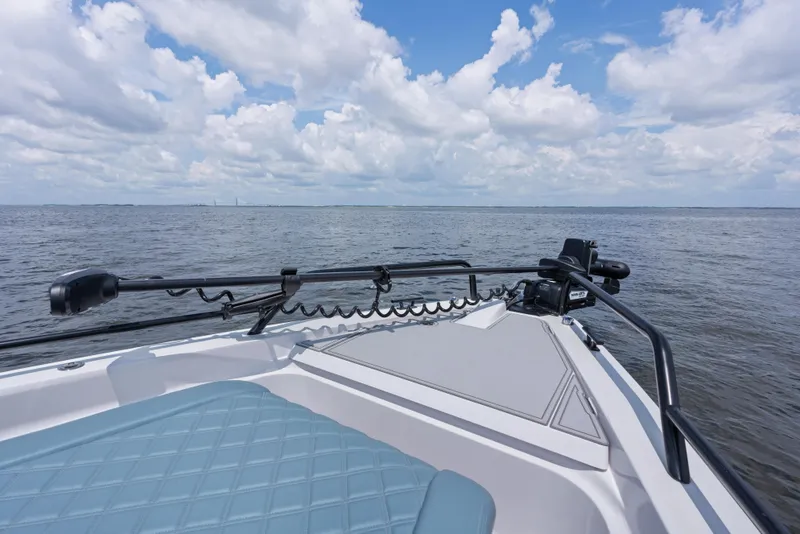 Slide: The Image of 2023 Axopar 37XC CROSS CABIN boat on open water under a cloudy sky. - 19