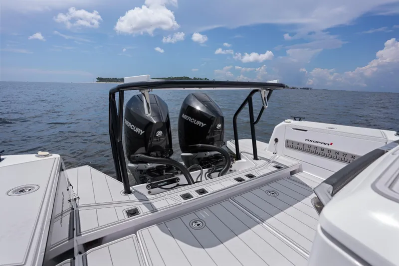 Slide: The Image of 2023 Axopar 37XC CROSS CABIN with dual Mercury engines on open water. - 20