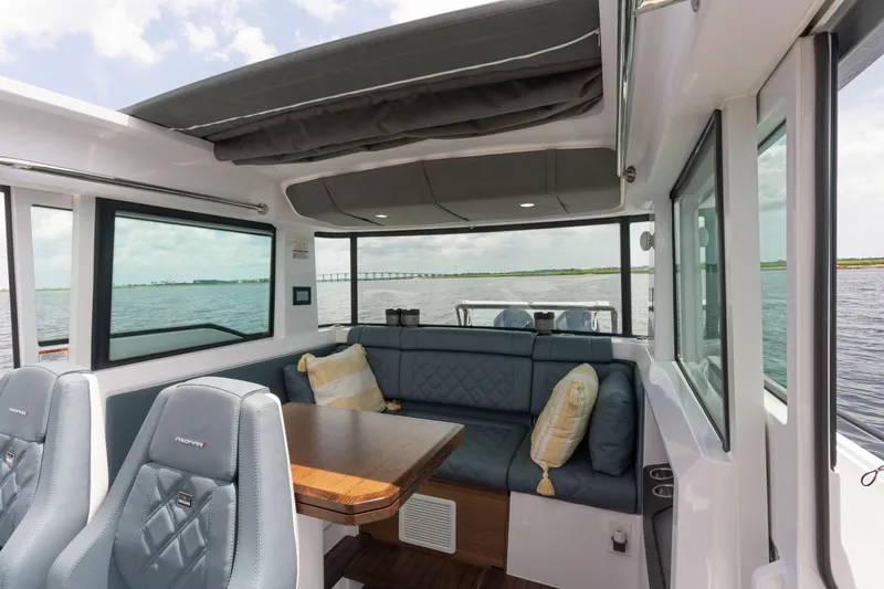 Slide: The Image of Luxurious interior of 2023 Axopar 37XC CROSS CABIN on the water. - 6