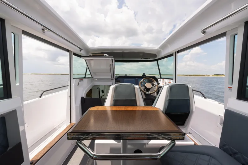 Slide: The Image of Interior of 2023 Axopar 37XC CROSS CABIN, featuring sleek design and modern seating. - 8