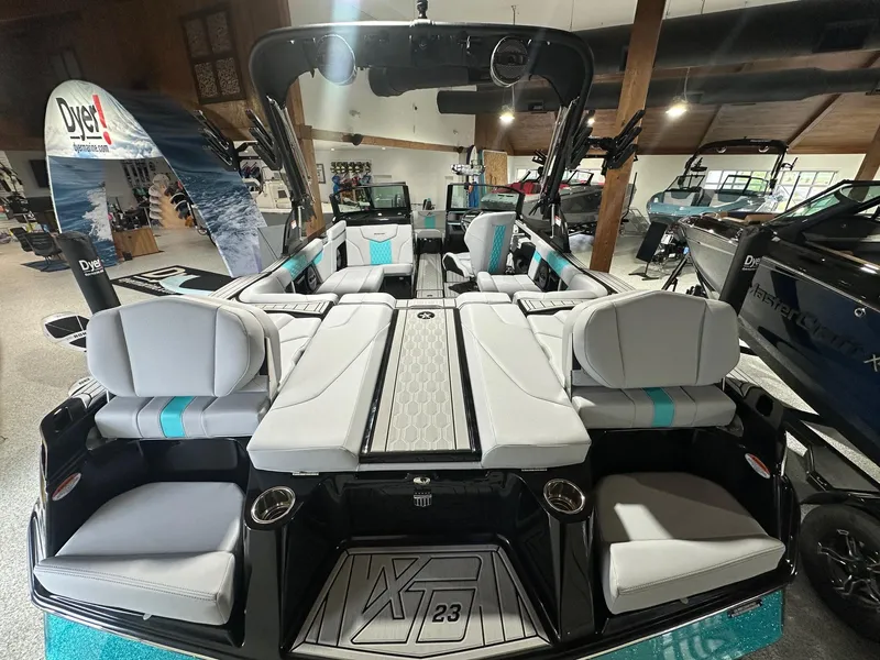 Slide: The Image of 2025 MasterCraft XT23 boat interior with sleek seating and modern design. - 2