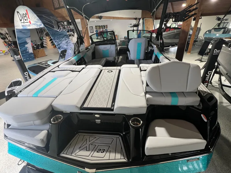 Slide: The Image of 2025 MasterCraft XT23 boat interior with sleek seating and modern design. - 3