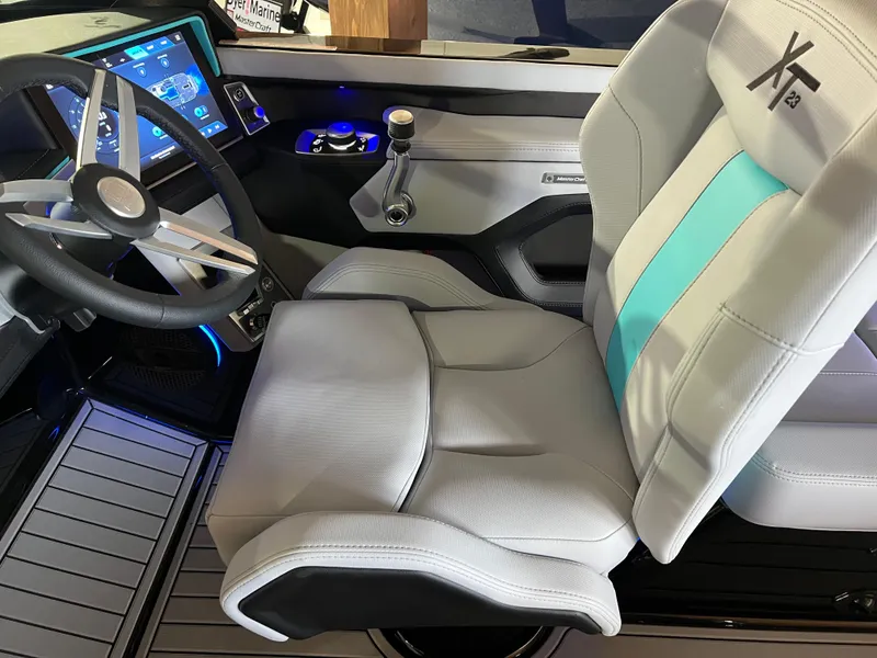 Slide: The Image of 2025 MasterCraft XT23 boat interior with modern dashboard and comfortable seating. - 7
