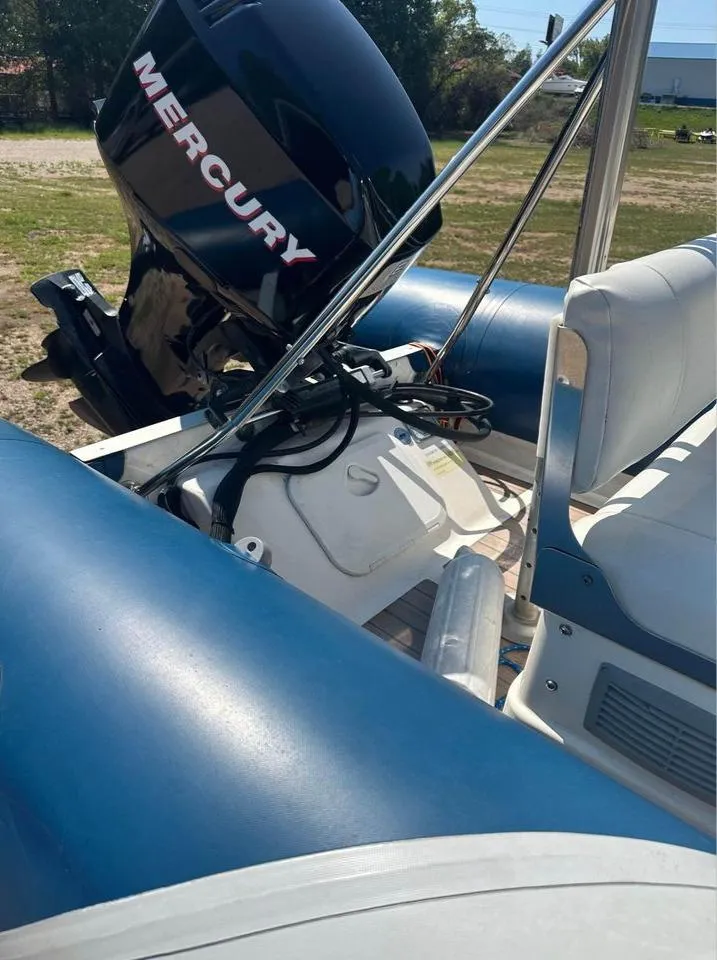 Slide: The Image of 2008 Valiant RIBs V520 boat with Mercury engine, blue and white seating. - 6