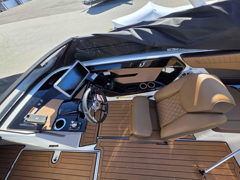 Slide: The Image of 2025 Yamaha Boats 222SE cockpit with modern controls, touchscreen display, and luxurious seating. - 12