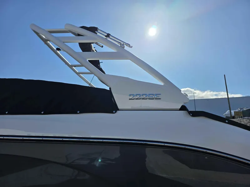 Slide: The Image of 2025 Yamaha Boats 222SE under bright sun, showcasing sleek design and logo. - 4