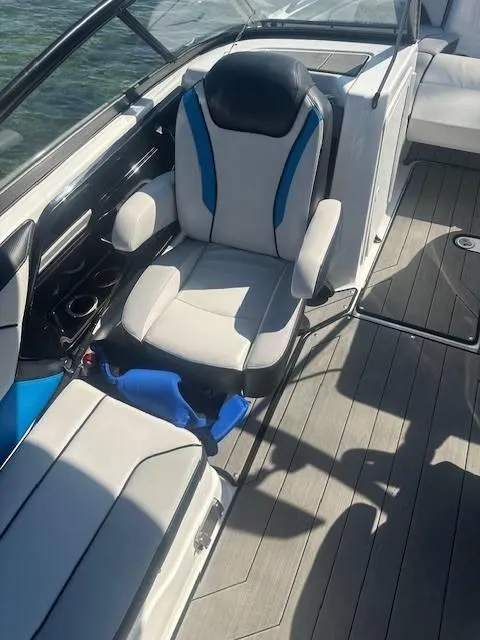 Slide: The Image of 2019 Yamaha Boats 212X interior with sleek seating and modern design. - 6