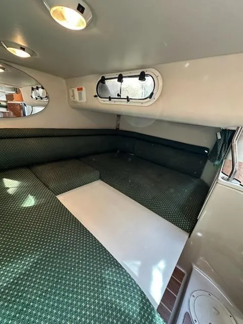 Slide: The Image of Interior cabin of 2000 Four Winns 328 Vista boat with green upholstery. - 22