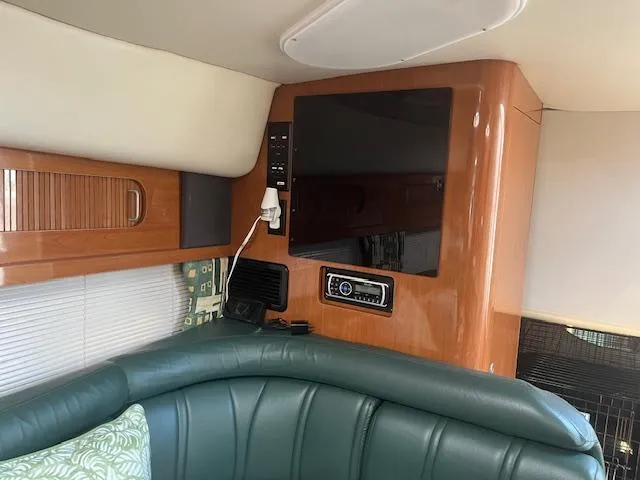 Slide: The Image of Interior of 2000 Four Winns 328 Vista boat with TV and green seating. - 25