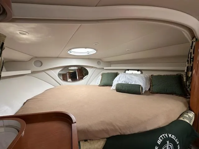 Slide: The Image of Cozy cabin interior of 2000 Four Winns 328 Vista yacht with bed and porthole. - 23