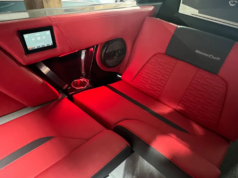 Slide: The Image of 2025 MasterCraft X24 interior with red leather seats and modern dashboard. - 10