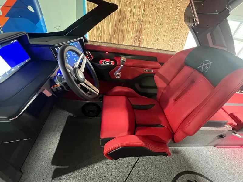 Slide: The Image of 2025 MasterCraft X24 interior with red seats and modern dashboard. - 9