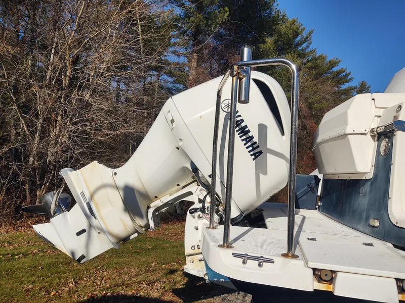Slide: The Image of 2018 Cutwater C-302 Coupe with Yamaha outboard motor, parked outdoors. - 3