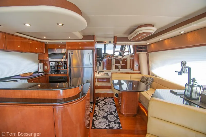 Slide: The Image of Luxurious interior of 2008 Meridian 580 Pilothouse yacht with modern kitchen and dining area. - 18