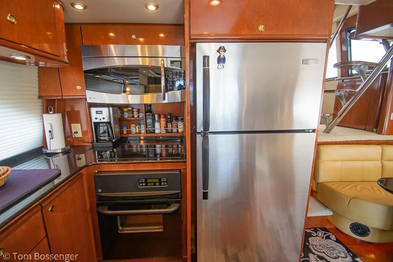Slide: The Image of Luxurious kitchen in 2008 Meridian 580 Pilothouse yacht with stainless steel appliances. - 22