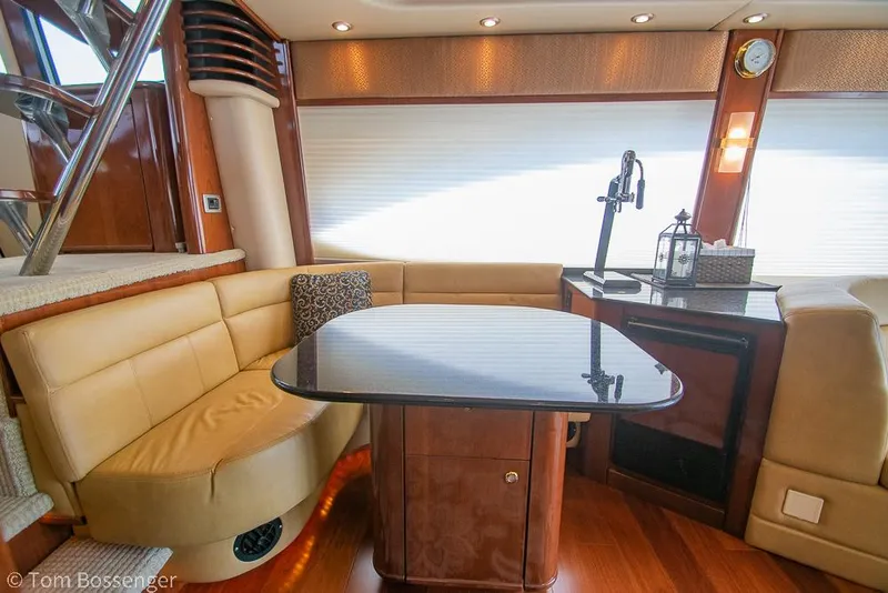 Slide: The Image of Luxurious interior of 2008 Meridian 580 Pilothouse yacht with elegant seating and table. - 24
