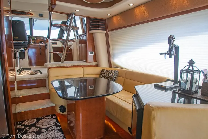 Slide: The Image of Luxurious interior of 2008 Meridian 580 Pilothouse yacht with elegant seating and dining area. - 25