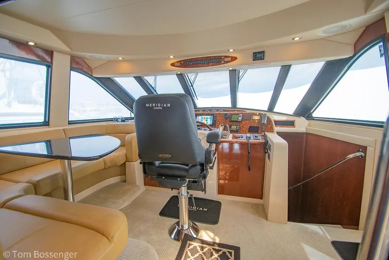 Slide: The Image of Luxurious 2008 Meridian 580 Pilothouse interior with helm and seating area. - 28