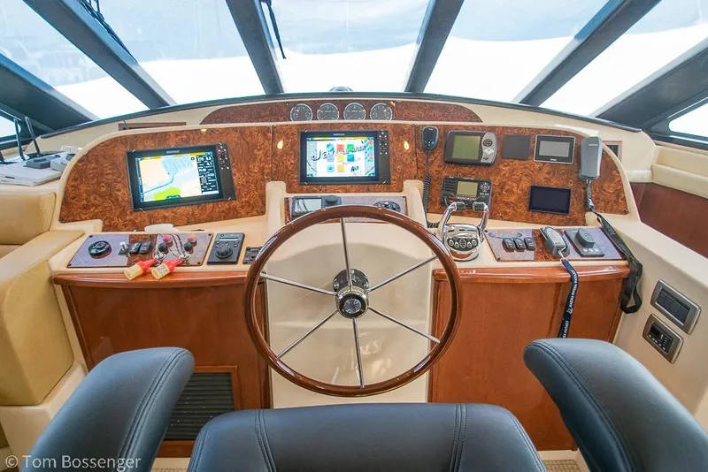 Slide: The Image of Pilothouse of 2008 Meridian 580, featuring navigation screens and steering wheel. - 31