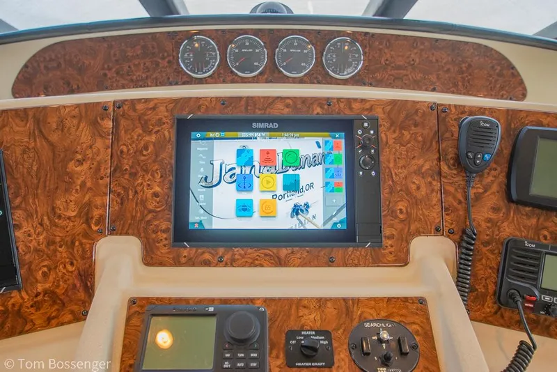 Slide: The Image of 2008 Meridian 580 Pilothouse dashboard with navigation equipment and wood paneling. - 33