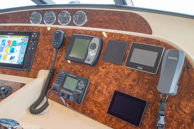 Slide: The Image of Dashboard of 2008 Meridian 580 Pilothouse with navigation and communication equipment. - 34