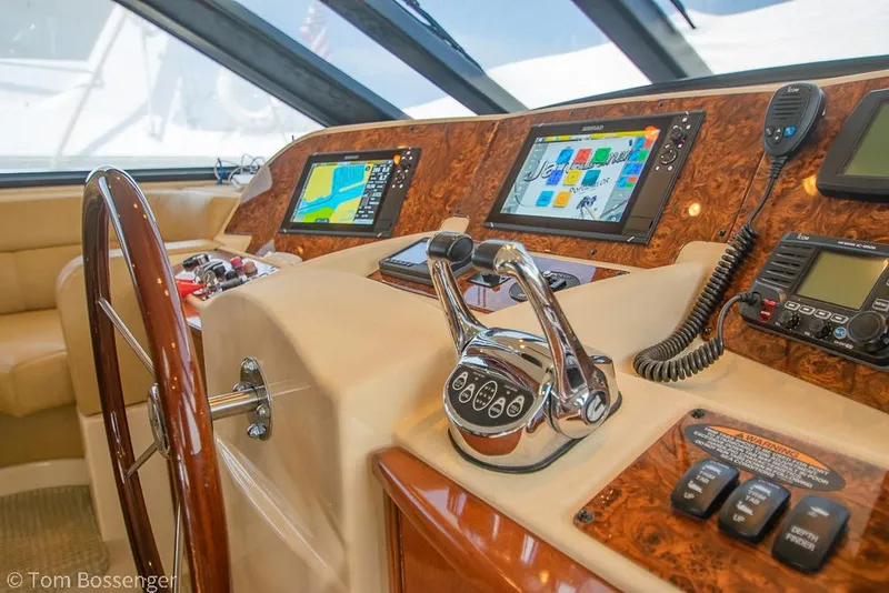 Slide: The Image of Pilothouse of 2008 Meridian 580 with navigation screens and controls. - 38