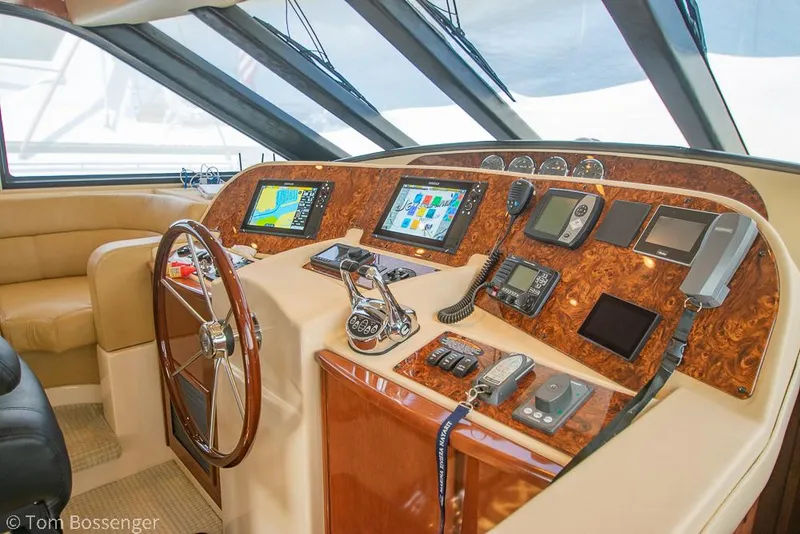 Slide: The Image of Pilothouse interior of 2008 Meridian 580, featuring navigation equipment and steering wheel. - 39